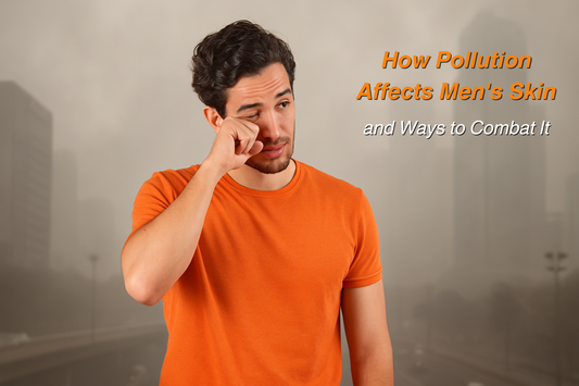 Young man in an orange t-shirt rubbing his eye against a polluted city background with text overlay ‘How Pollution Affects Men's Skin and Ways to Combat It.