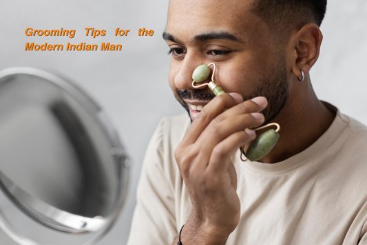 ndian man grooming his face with a jade roller while smiling in front of a mirror.