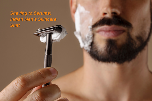 Close-up of an Indian man holding a razor with shaving cream on his face, highlighting the shift from shaving to modern skincare routines.