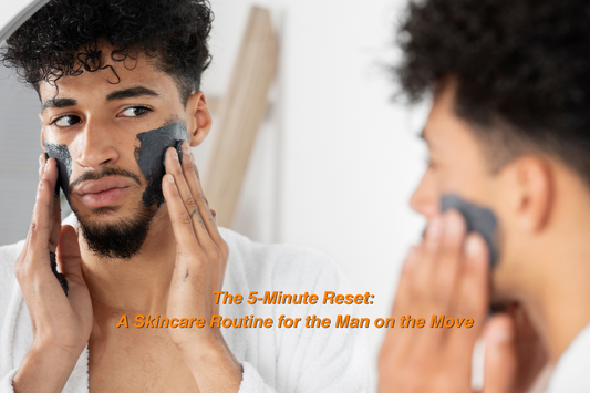 oung man applying a charcoal face mask while looking in the mirror, representing a quick and effective men’s skincare routine for busy lifestyles