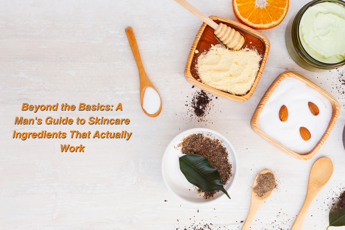 Flat lay of natural skincare ingredients including honey, orange slices, almond cream, and herbal powders, representing essential elements for effective men’s skincare routines.